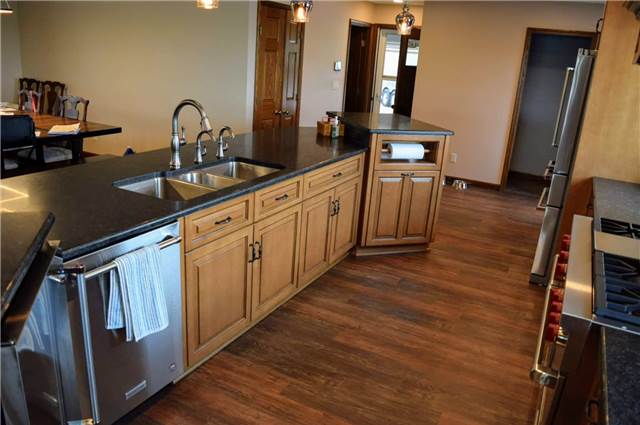 Stained & glazed maple island cabinets - honed granite countertops